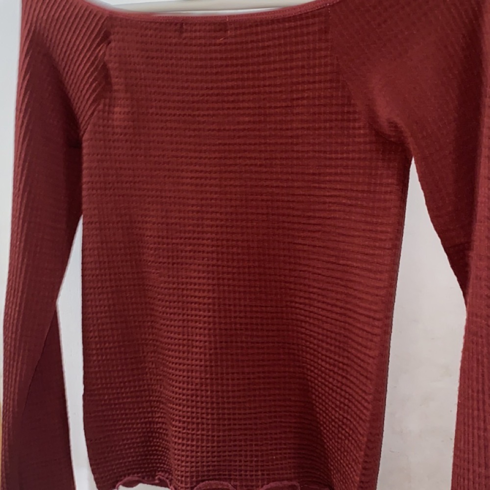 off shoulder long sleeve with buttons top in a size medium.